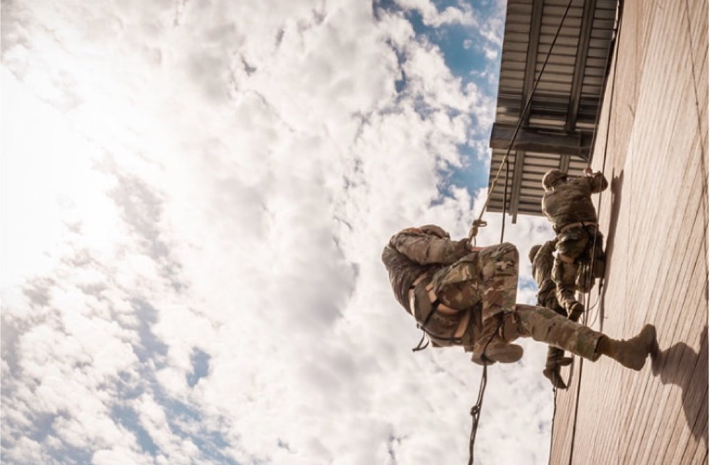 The national guard running up an obstacle